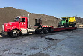 Truck Transporting a Large Vehicle