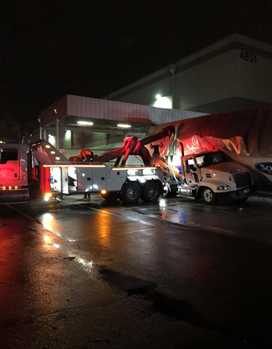 Tow Truck Cleaning Up Accident